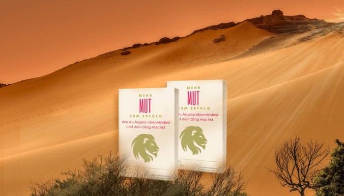 Zwei Bücher in der Wüste stehend: Mut zum Erfolg als Titel
